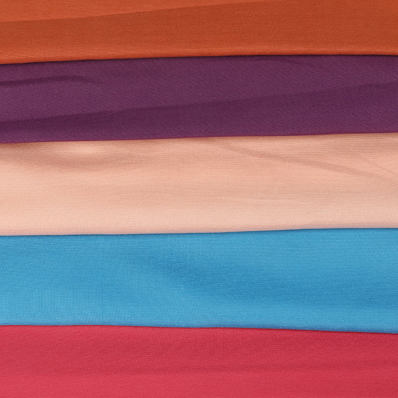 Plain dyed fabric is a type of fabric that has been treated with a dyeing process to create a solid, uniform color.