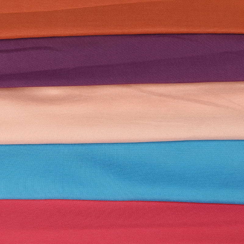 Plain dyed fabric is a type of fabric that has been treated with a dyeing process to create a solid, uniform color.